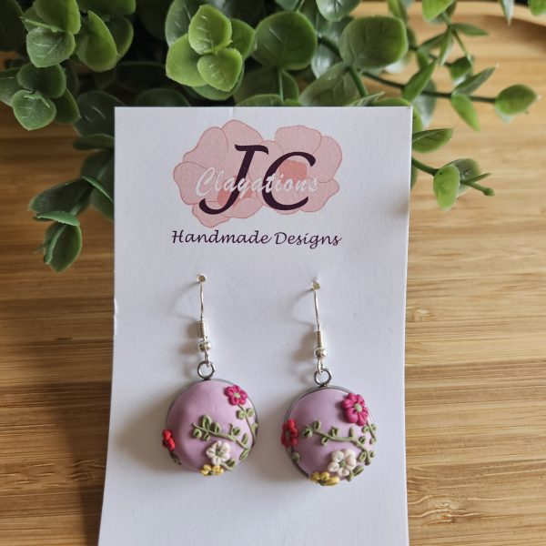 Floral silver base round dangles